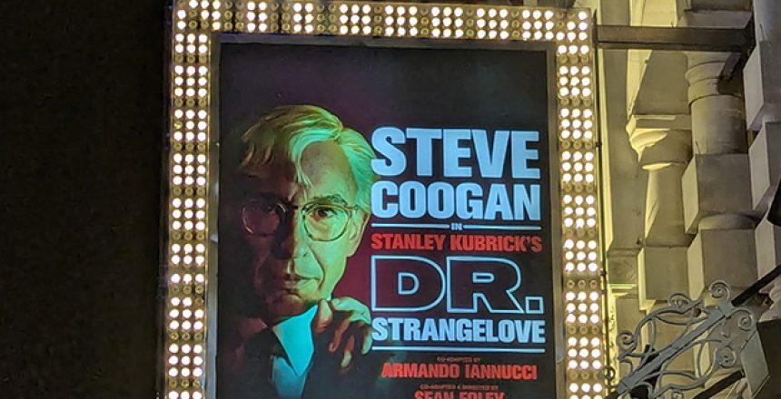 Illuminated street hoarding advertising the play Dr Strangelove